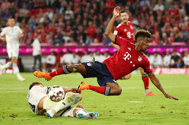 Bayern Munich's Kingsley Coman in action with Hoffenheim's Ermin Bicakcic. Photo: Reuters