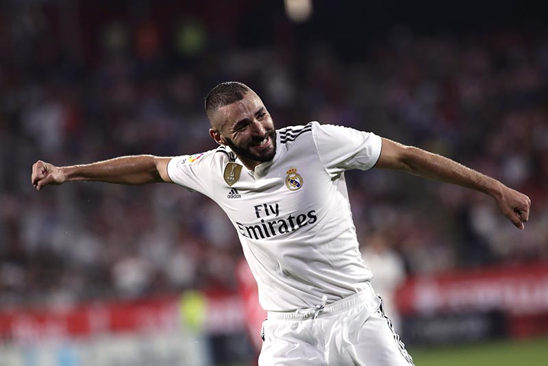 Real Madrid's Karim Benzema celebrates scoring his side's 4th goal during the Spanish La Liga soccer match between Girona and Real Madrid at the Montilivi stadium in Girona, Sunday, August 26, 2018. Photo: AP