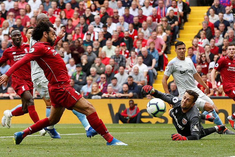 Liverpool's Mohamed Salah scores their first goal. Photo: Reuters