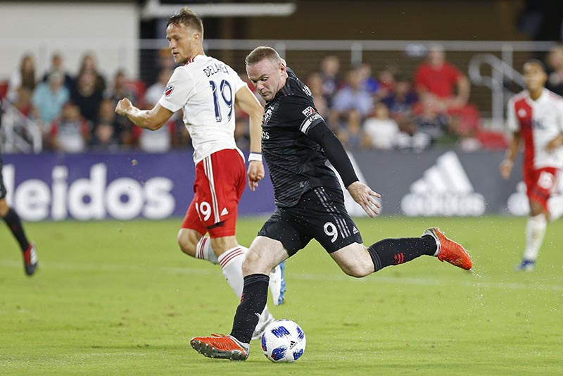 DC United forward Wayne Rooney (9) shoots the ball as New England Revolution defender Antonio Delamea Mlinar (19) looks on in the first half at Audi Field, in  Washington, DC, USA, on August 19, 2018. Photo: Geoff Burke-USA TODAY Sports via Reuters