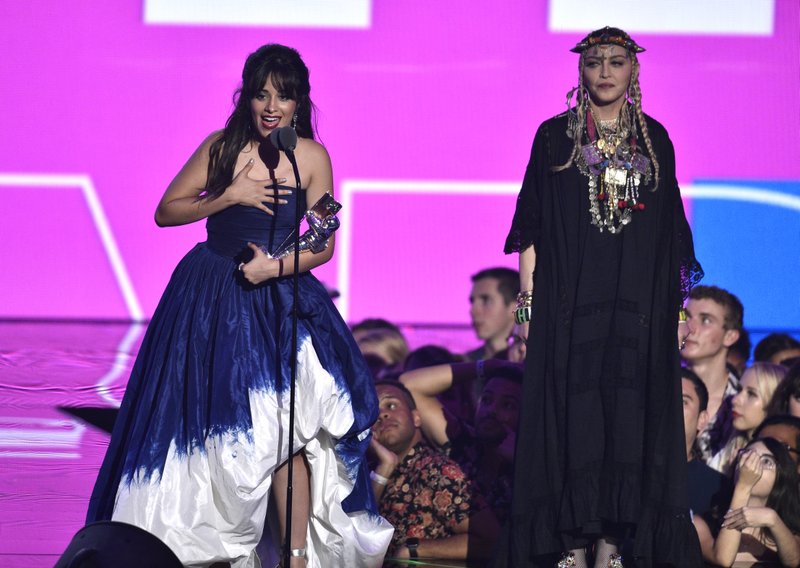 Camila Cabello, left, accepts the award for video of the year as presenter Madonna looks on at the MTV Video Music Awards at Radio City Music Hall on Monday, Aug. 20, 2018, in New York. Photo: AP