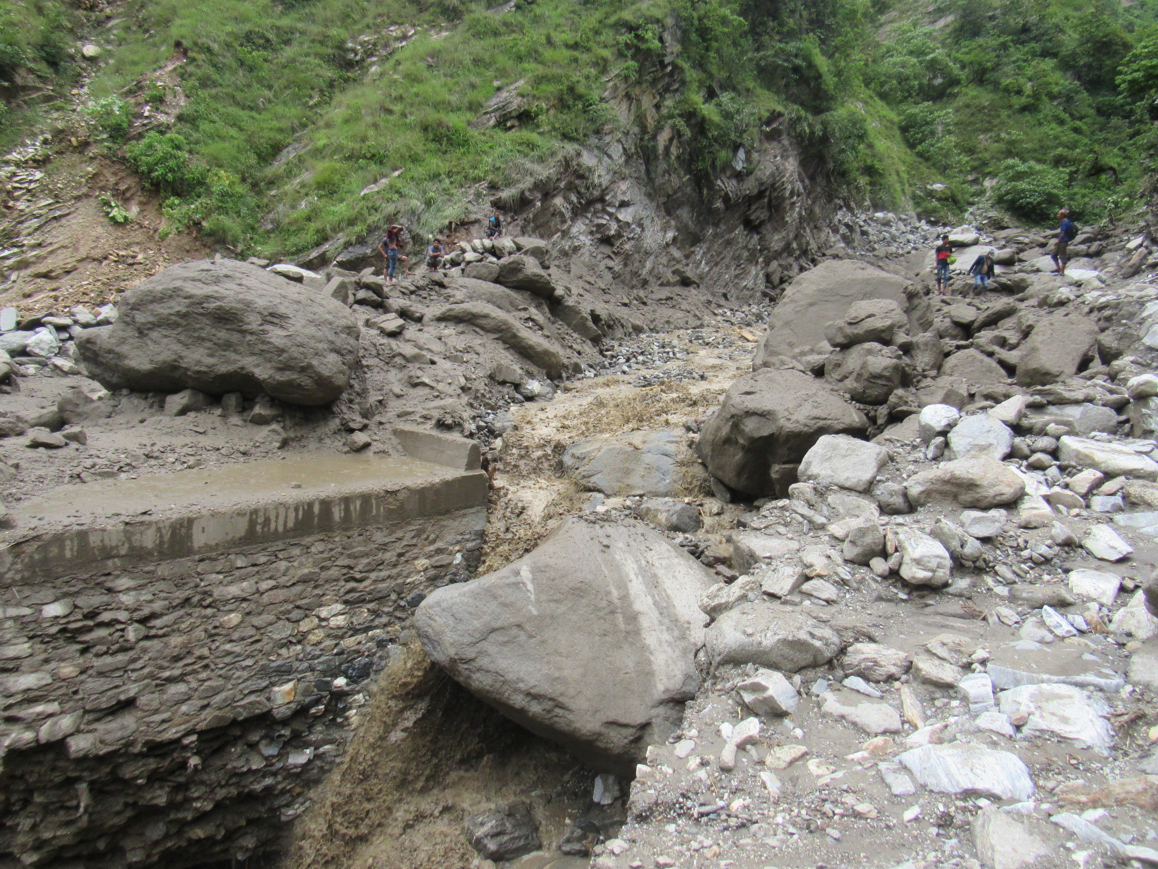 A stretch along Sanphe-Martadi roadway is seen completely destroyed by multiple landslips. Photo: Prakash Singh Bajura/THT