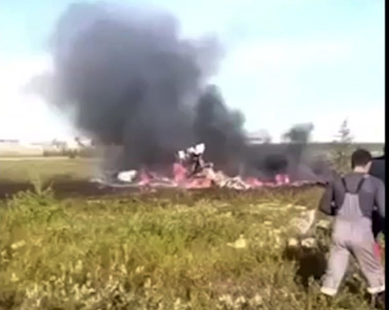 In this image made video, smoke rises from a crash side of a Russian helicopter Mi-8 crashed shortly after takeoff in Vankor, above the Arctic Circle in Siberia, Russia, Saturday, August 4, 2018. Photo:@CHP.KRAS via AP