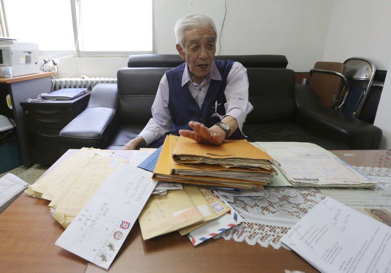 In this photo, Kim Kyung-jae, 86, speaks in front of letters sent from his North Korean sister during an interview at his office in Seoul, South Korea on Aug. 22, 2018. Photo: AP