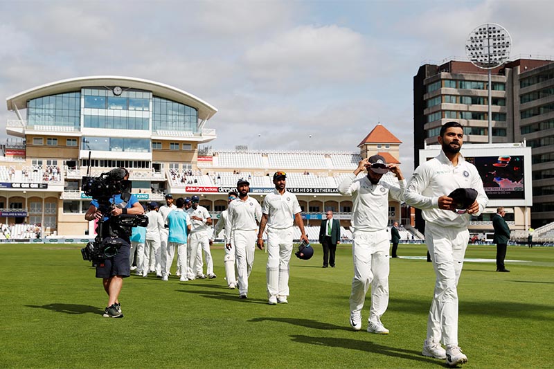 India's Virat Kohli leaves the field with teammates after the match as India win the third test. Photo: Reuters