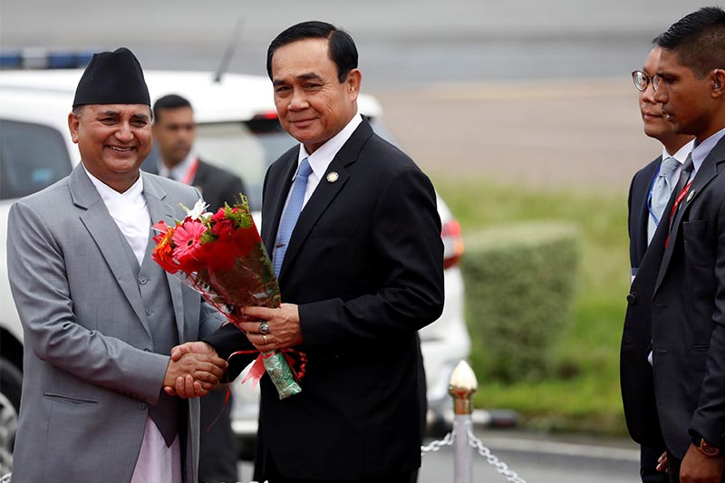 Deputy Prime Minister and Defence Minister Ishwor Pokhrel shakes hands with Thailand's Prime Minister Prayut Chan-o-cha upon latter's arrival at Tribhuvan International Airport in Kathmandu, on August 30, 2018. The Thai PM will attend the Bay of Bengal Initiative for Multi-Sectoral Technical and Economic Cooperation (BIMSTEC) summit. Photo: Reuters