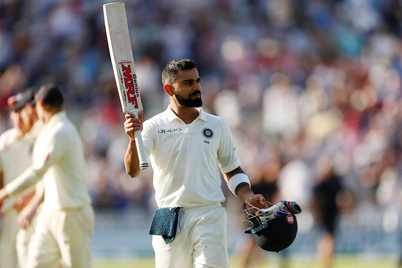 India's Virat Kohli salutes the fans as he walks off the pitch after losing his wicket. Photo: Reuters