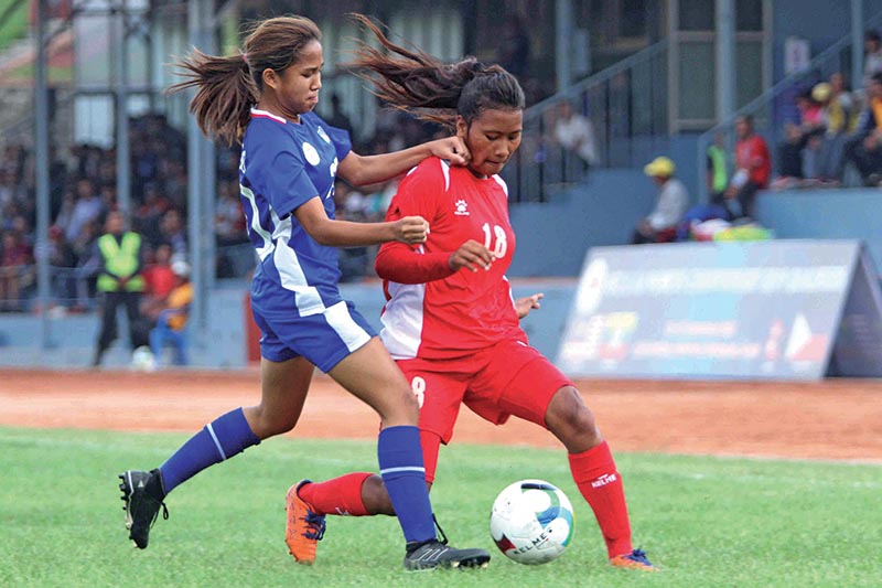 Nepal’s Asmita Chaudhary (right) vies for the ball with Micha Pauline Santiago of the Philippines during their AFC U-16 Women’s Championship Group E Qualifiers match at the Nepal APF Club grounds in Kathmandu on Wednesday. Photo: Udipt Singh Chhetry/ THT