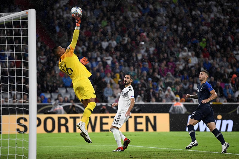 France's Alphonse Areola and Lucas Hernandez in action with Germany's Ilkay Gundogan. Photo: Reuters