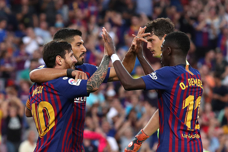 Barcelona's Lionel Messi celebrates scoring their sixth goal with team mates during the  La Liga Santander match between FC Barcelona and SD Huesca, at Camp Nou,in  Barcelona, Spain, on September 2, 2018. Photo: Reuters