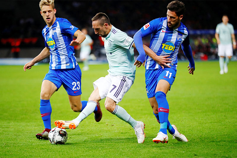 Bayern Munich's Franck Ribery in action with Hertha Berlin's Arne Maier and Mathew Leckie. Photo: Reuters