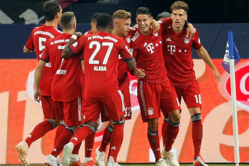 Bayern Munich's James Rodriguez celebrates scoring their first goal with team mates. Photo: Reuters