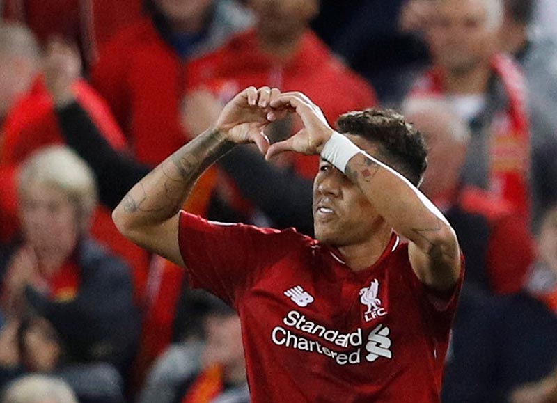 Liverpool's Roberto Firmino celebrates scoring their third goal during the Champions League, Group Stage, Group C match between Liverpool and Paris St Germain, at Anfield, in Liverpool, Britain, on September 18, 2018. Photo: Reuters