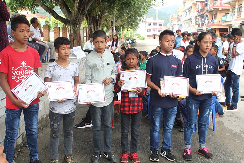 Children staying at various children's home pose for a photograph after winning a drawing competition in Damauli of Tanahun district, on Friday, September 14 2018. Photo: Madan Wagle/THT