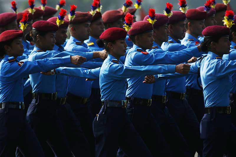A team of police personnel march past in a programme organised to mark the Constitution Day at Nepal Army pavilion in Tundikhel, Kathmandu, on Wednesday, September 19, 2018. Photo: Skanda Gautam/THT