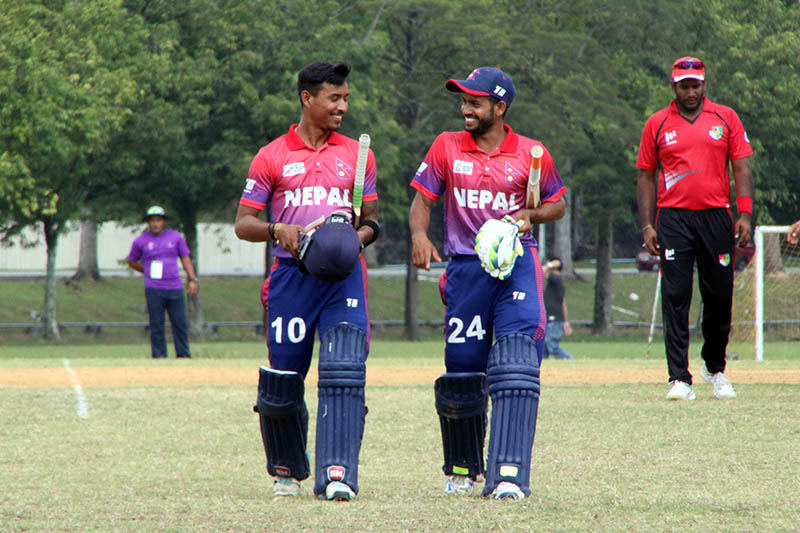 Nepali batsmen leaving field after taking the team home. Courtesy: Raman Shiwakoti