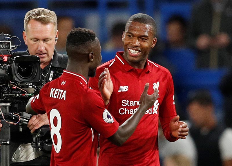 Liverpool's Daniel Sturridge celebrates after the match with Naby Keita during the Premier League match between Chelsea and Liverpool, at Stamford Bridge, in London, Britain, on September 29, 2018. Photo: Action Images via Reuters