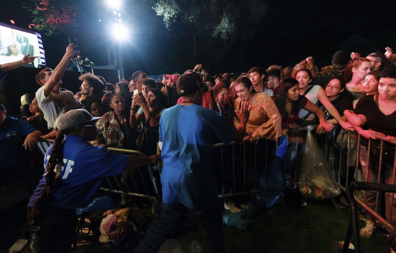 Concert goers surge forward after a barricade got knocked over at the 2018 Global Citizens Festival in Central Park on Saturday, Sept. 29, 2018, in New York. Photo: AP