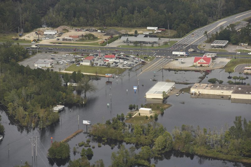 In this Monday, Sept. 24, 2018 photo, flood waters from the Neuse River cover the area a week after Hurricane Florence in Kinston, N.C. on Monday Sept. 24, 2018. Photo: APn