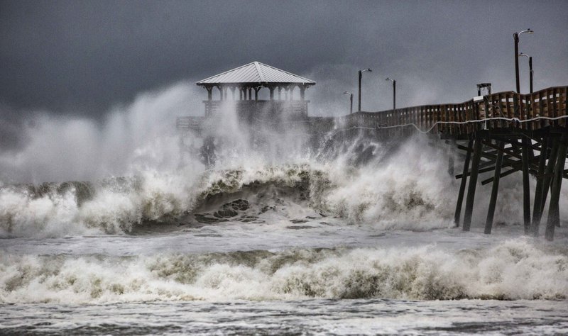 Waves slam the Oceana Pier &amp; Pier House Restaurant in Atlantic Beach, N.C., on Thursday, Sept. 13, 2018 as Hurricane Florence approaches the area. Photo: AP