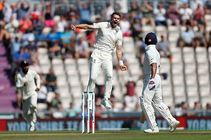 England's James Anderson celebrates taking the wicket of India's Shikhar Dhawan. Photo: Reuters