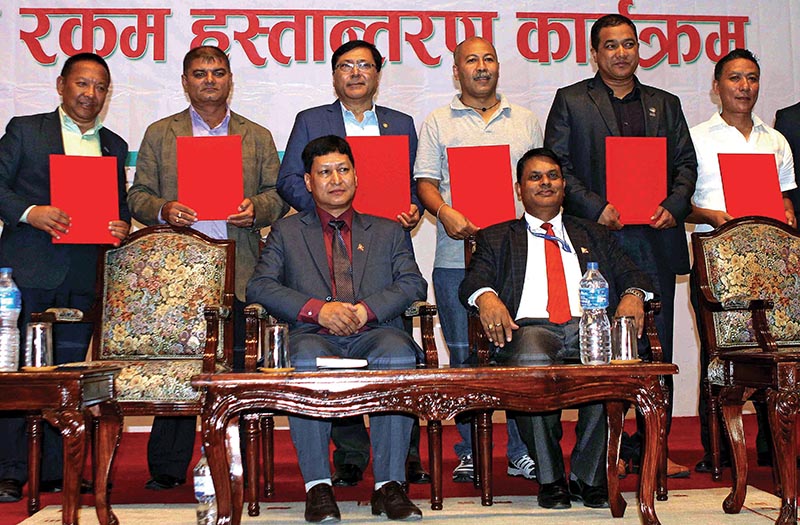 Presidents of u2018Au2019 division football clubs pose for group photo with Mayor of Kathmandu Metropolitan City Bidhya Sundar Shakya (front row, left) after signing agreements with KMC at the City Hall in Kathmandu on Monday. Photo: THT