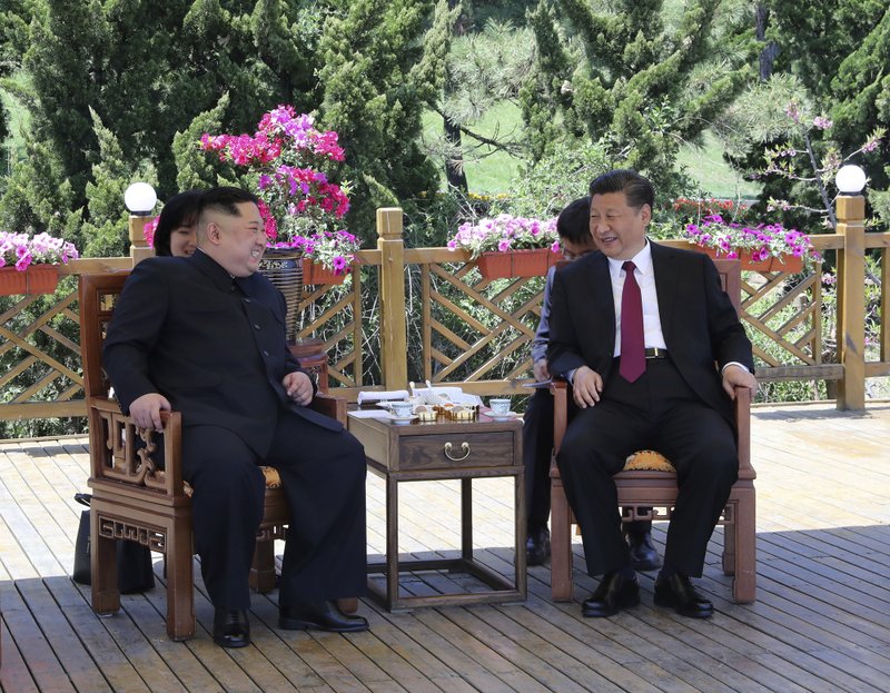 FILE - In this file photo taken between May 7 and 8, 2018, released by Chinau2019s Xinhua News Agency, Chinese President Xi Jinping, right, speaks to North Korean leader Kim Jong Un in Dalian in northeastern Chinau2019s Liaoning Province. Photo: AP