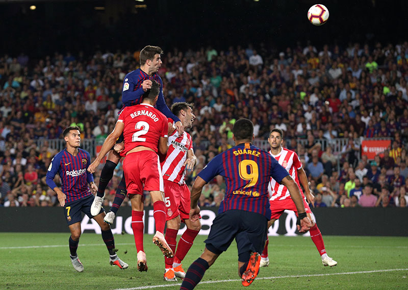 Barcelona's Gerard Pique scores their second goal during the La Liga Santander match between FC Barcelona and Girona, at Camp Nou, in Barcelona, Spain, on September 23, 2018. Photo: Reuters