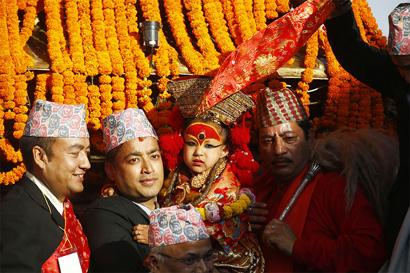 Nepalu2019s Living Goddess Kumari is placed on a chariot during Indra Jatra festival, celebrated to honour Indra, the king of heaven and lord of rains, in Kathmandu, on Monday, September 24, 2018. Photo: Skanda Gautam/THT