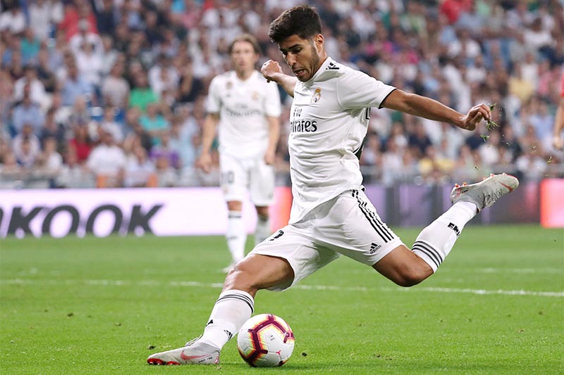 Real Madrid's Marco Asensio scores their first goal. Photo: Reuters