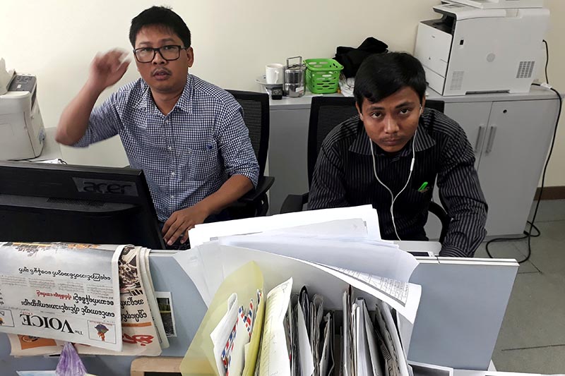 Reuters journalists Wa Lone (left) and Kyaw Soe Oo, who are based in Myanmar, pose for a picture at the Reuters office in Yangon, Myanmar December 11, 2017. Photo: Reuters/ File