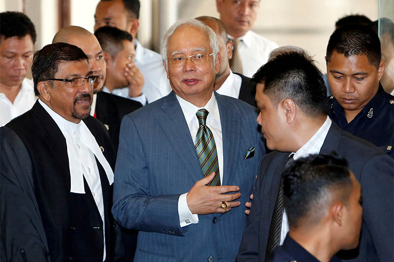 File: Malaysia's former prime minister Najib Razak walks out of a courtroom in Kuala Lumpur, Malaysia August 8, 2018. Photo: Reuters