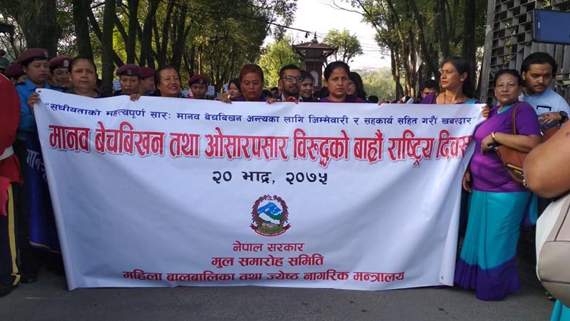 Nepal Police personnel and representatives of various organisations including rights activists participate in a rally  organised by the Ministry of Women, Children and Senior Citizen to mark the 12th National Day against Human Trafficking, at Bhrikuti Mandap, Pradarshani Marga, Kathmandu, on Wednesday, September 5, 2018. Photo: Suresh Chaudhary/THT Online