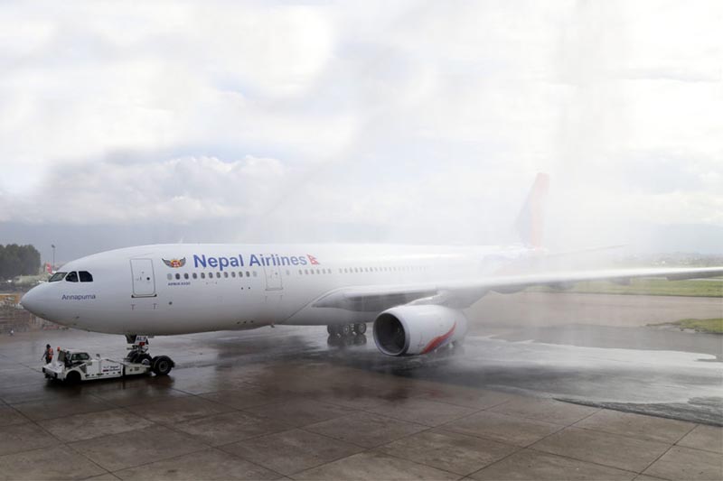 A new first long-range Airbus A330-200 aircraft of Nepal Airlines Corporation is welcomed by a traditional water cannon salute at Tribhuvan International Airport in Kathmandu, on Thursday, June 28, 2018. Rolls-Royce Trent 700 engines power the new aircraft. Photo: Skanda Gautam/THT