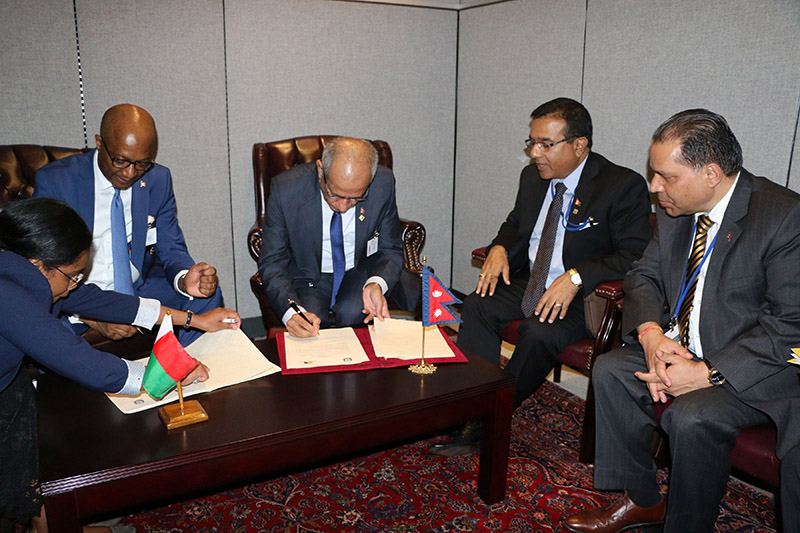 Minister for Foreign Affairs Pradeep Kumar Gyawali and Minister for Foreign Affairs of Madagascar Eloi Alphonse Maxime Dovo signing a Joint Communiquu00e9 establishing diplomatic relations between the two countries at a ceremony in New York, on September 27, 2018. Photo: RSS