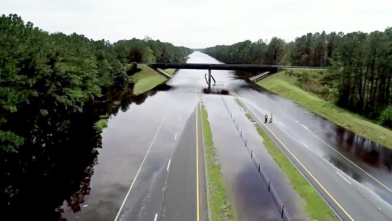 Flooding is seen near River Road bridge on Interstate 40 in Duplin County, North Carolina, US, on Monday, September 17, 2018 in this still image taken from a social media video. Photo: North Carolina Division of Aviation/via Reuters