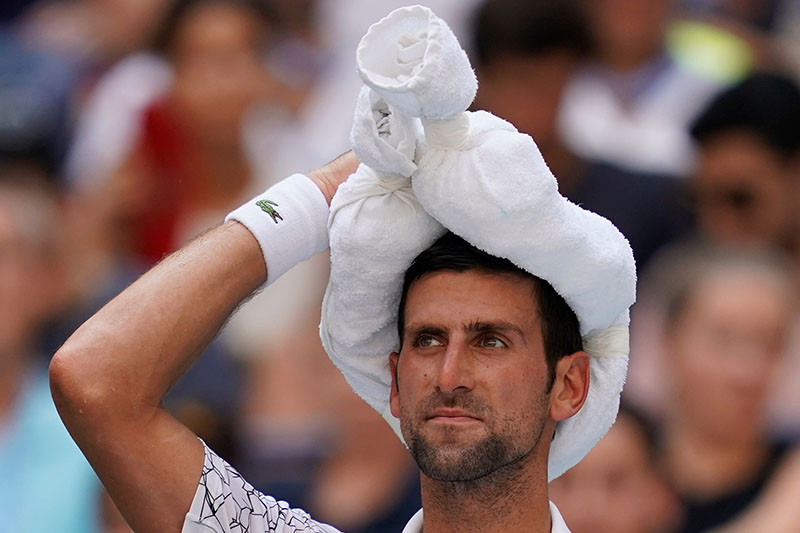 Novak Djokovic of Serbia keeps cool between games while playing Joao Sousa of Portugal in a fourth round match on day eight of the 2018 US Open tennis tournament at USTA Billie Jean King National Tennis Center. Mandatory Credit: Robert Deutsch-USA TODAY Sports