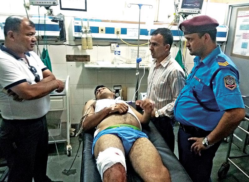 An injured policeman, who was shot at by unidentified gunmen, receiving treatment in Dharan-based BP Koirala Institute of Health and Sciences, Sunsari, on Thursday, September 20, 2018. Photo: THT