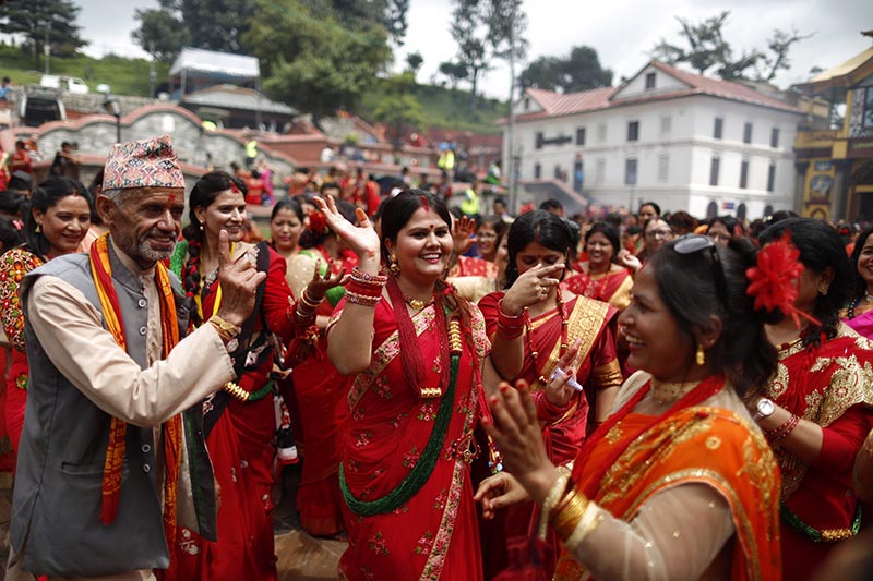 Devoted Hindu women dance and sing during Teej festival on the premises of Pashupathinath Temple in Kathmandu, on Wednesday, September 12, 2018. Photo: Skanda Gautam/THT