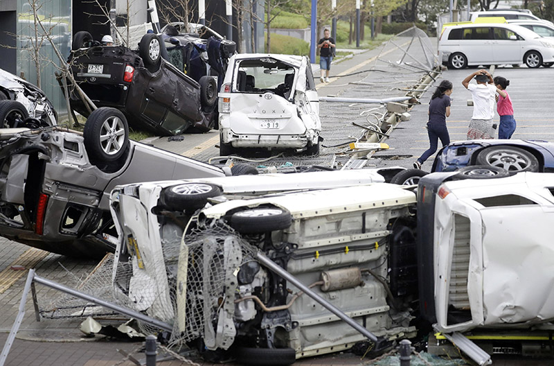 Vehicles damaged by Typhoon Jebi are seen in Osaka, western Japan,u00a0in this photo taken by Kyodo, on Tuesday, September 4, 2018. Photo: Kyodo/via Reuters