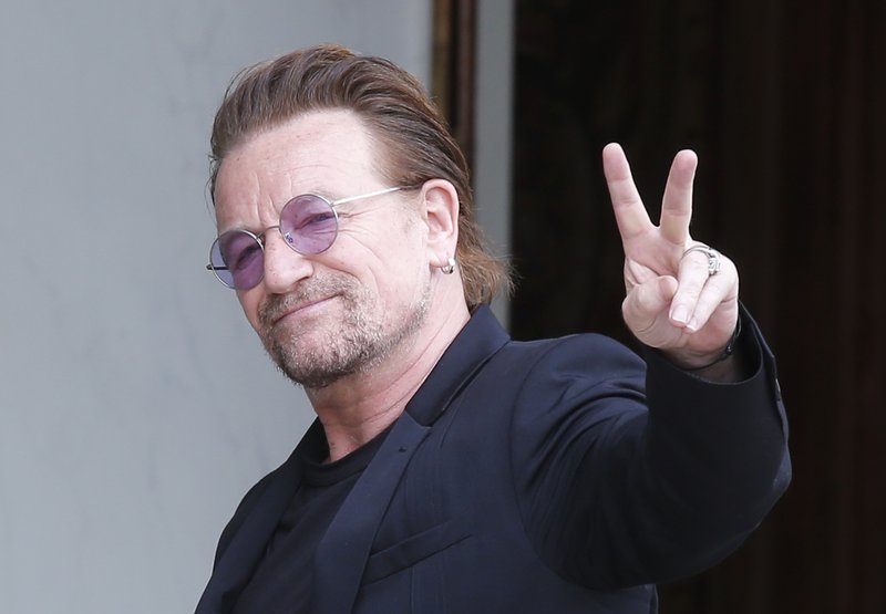FILE - In this photo, U2 singer Bono makes a peace sign as he arrives for a meeting at the Elysee Palace, in Paris, France on  Monday, July 24, 2017. Photo: APn