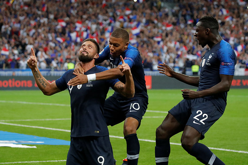 France's Olivier Giroud celebrates scoring their second goal with Kylian Mbappe and Benjamin Mendy during UEFA Nations League, League A, Group 1 match between France and  Netherlands, at Stade de France, in Saint-Denis, France, on September 9, 2018. Photo: Reuters