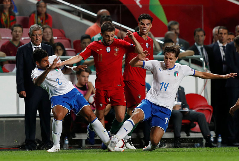 Portugal's Bernardo Silva in action with Italy's Emerson Palmieri and Federico Chiesa during UEFA Nations League, League A, Group 3 match between Portugal and  Italy, at  Estadio da Luz, in Lisbon, Portugal, on September 10, 2018. Photo: Reuters