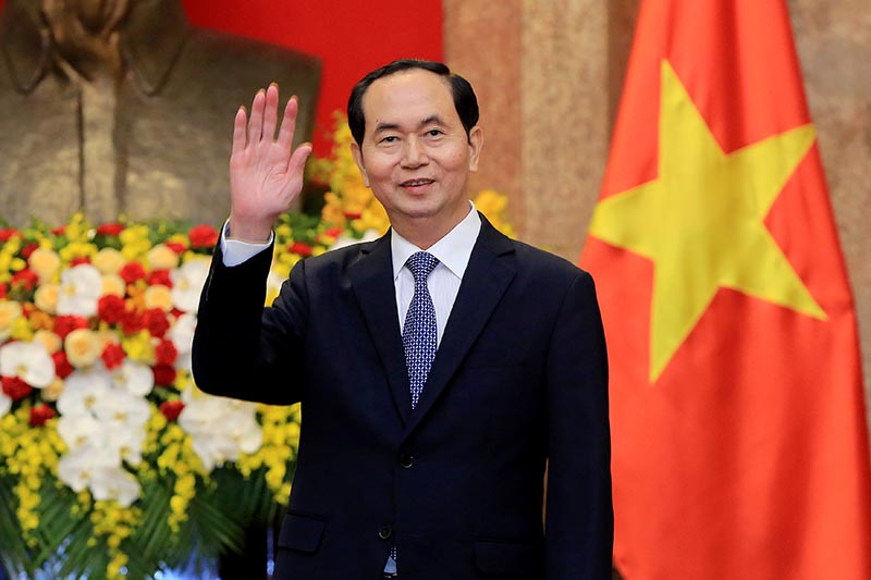 Vietnamese President Tran Dai Quang greets journalists as he waits for the arrival of Russian Foreign Minister Sergei Lavrov (not pictured) at the Presidential Palace in Hanoi, Vietnam March 23, 2018. Photo: Minh Hoang/Pool via Reuters