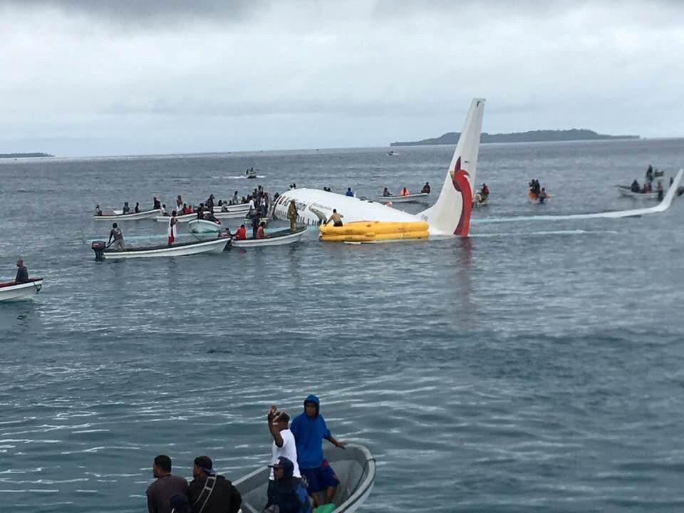People are evacuated from an Air Niugini plane crashed in the waters in Weno, Chuuk, Micronesia, September 28, 2018 in this picture obtained from social media. Photo: Reuters