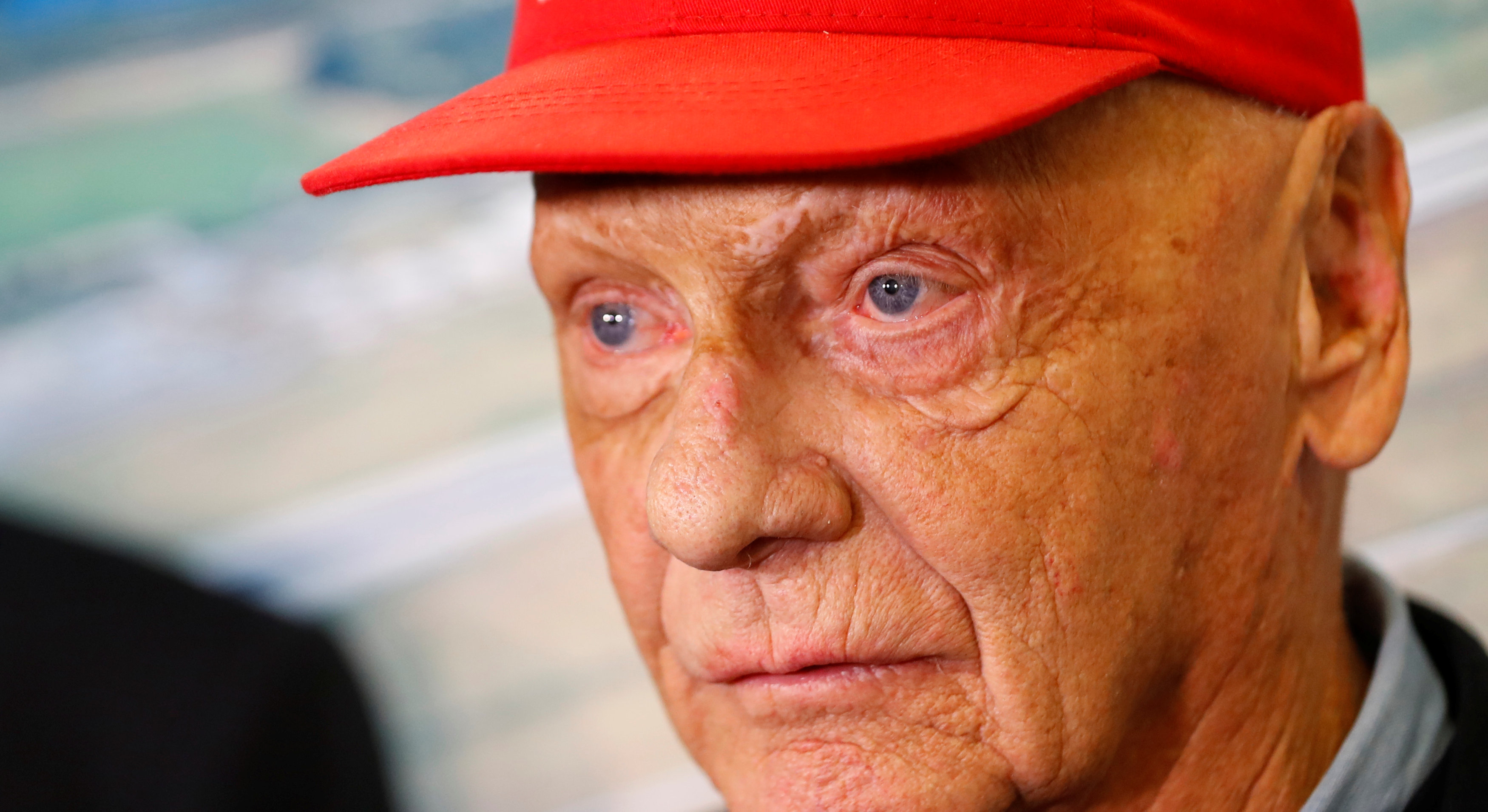 FILE PHOTO: Niki Lauda talks to the media at the airport in Duesseldorf, Germany, March 20, 2018. REUTERS