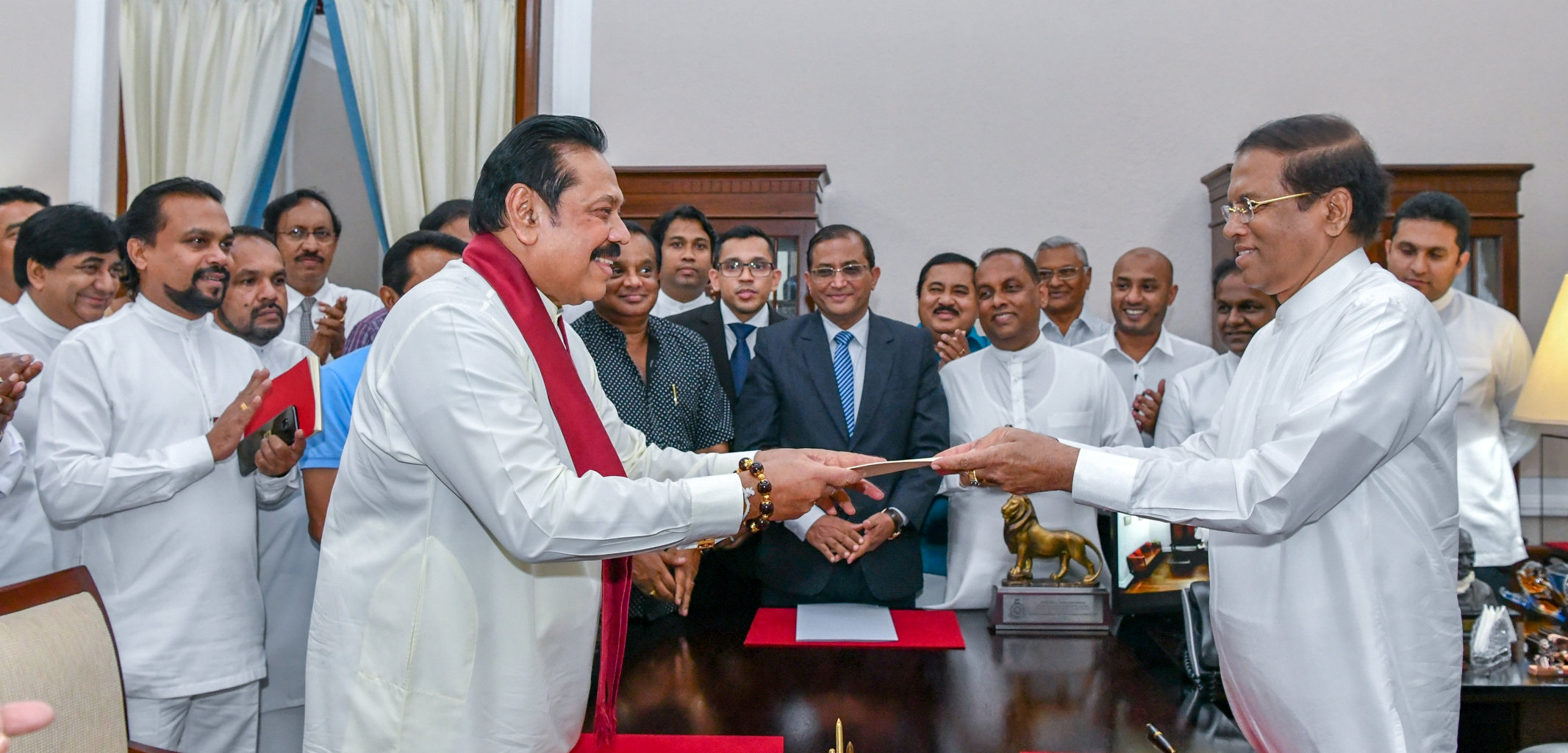 Sri Lanka's former President Mahinda Rajapaksa (Front-L) is sworn in as the new Prime Minister before President Maithripala Sirisena in Colombo, Sri Lanka October 26, 2018. Sri Lanka's President's Office. Photo: Reuters
