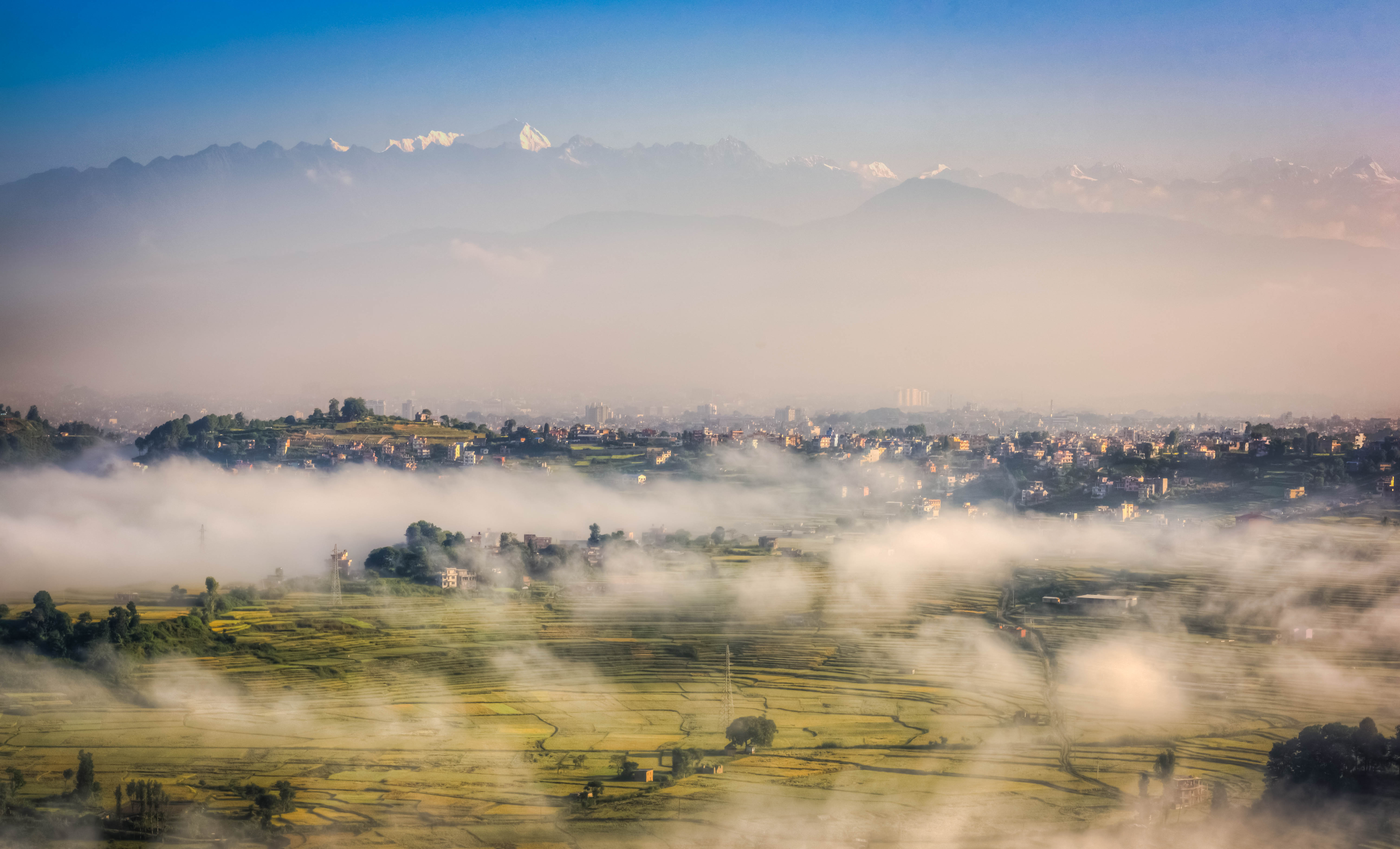 An aerial view of Kathmandu valley covered in fog.