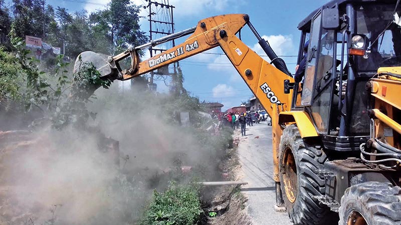Illegal infrastructure being demolished along Araniko Highway in Sanga, Kavre, on Monday, October 1, 2018. Photo: THT