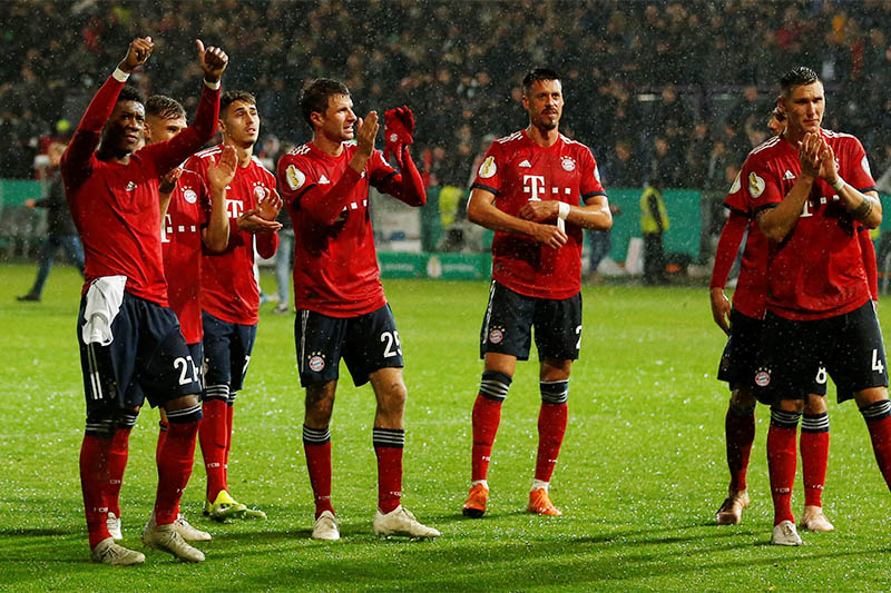 Bayern Munich's Thomas Mueller, David Alaba, Sandro Wagner and team mates celebrate after the match. Photo: Reuters